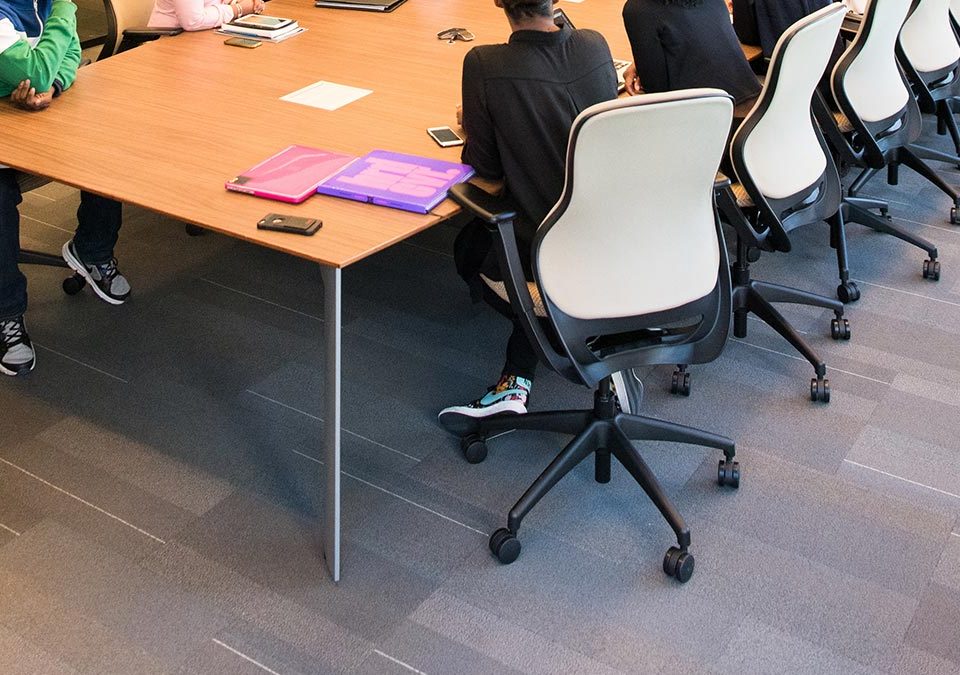 people around a boardroom