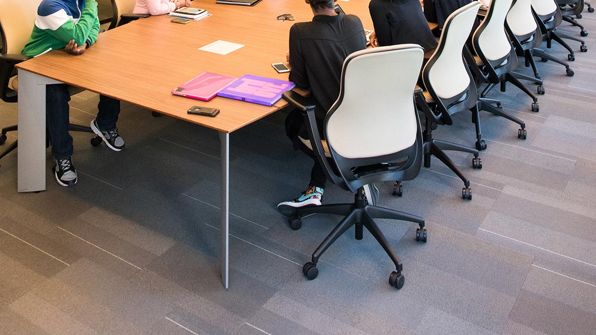 people around a boardroom